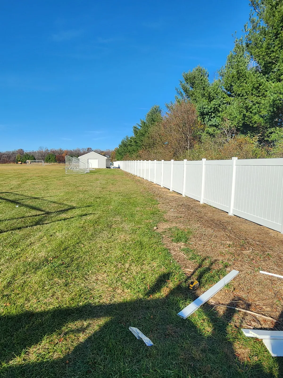 White vinyl privacy fence on residential property